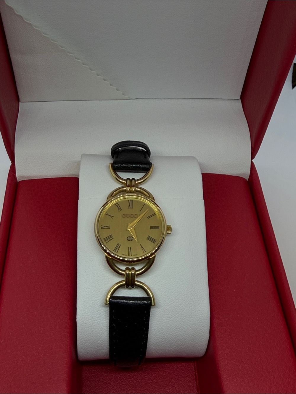 Gucci Gold-Tone Round Women's Watch with Black Leather Strap